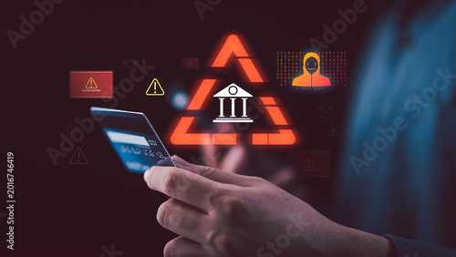 Cybersecurity analyst monitoring digital banking cyberattack and credit card fraud alerts while hackers target online payment systems, exposing financial data breaches and transaction risks.