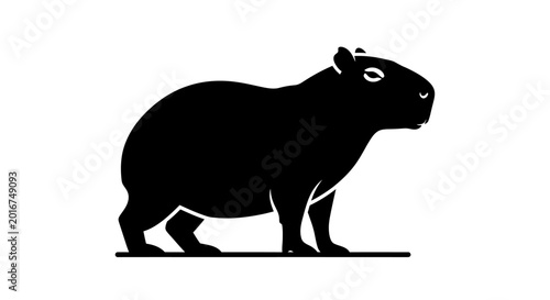 Monochromatic silhouette of a capybara, a large South American rodent, perfect for minimalist nature-themed designs or educational graphics