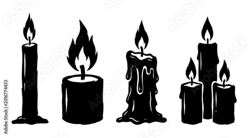 Tableau sur toile A collection of four distinct black silhouette candles with flickering flames