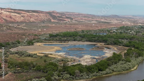 Aerial of wetlands along Colorado River in Grand Junction Colorado in red desert landscape