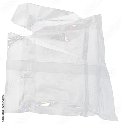Torn transparent plastic bag isolated on black background, ripped clear poly bag with jagged edges