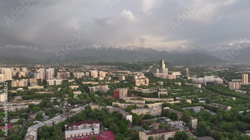 A drone view of the central part of Almaty, Kazakhstan, during sunset on a spring evening.