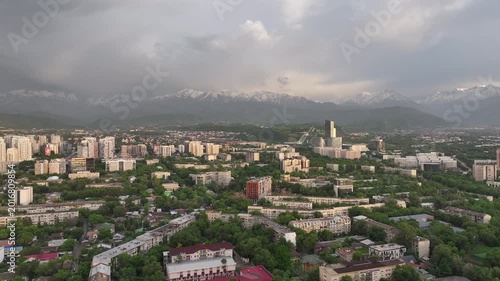 A drone view of the central part of Almaty, Kazakhstan, during sunset on a spring evening.