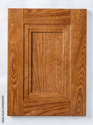 Bilde på lerret Elegant wooden cabinet door showcasing rich grain patterns in warm tones for kit