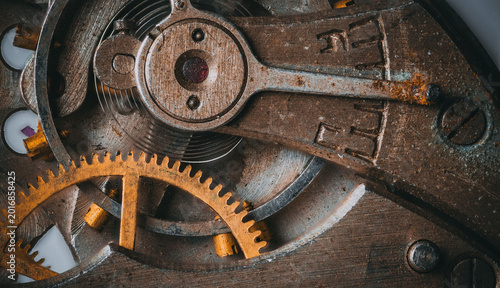 Close-up of rusted gears and balance wheel in vintage watch