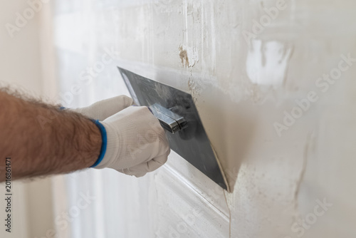 Quadro su tela Finishing application of smooth plaster using a metal trowel on interior wall