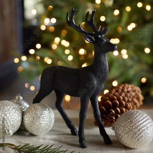 Black Reindeer Decoration Near Pine Cones and Holiday Ornaments in a Festive ...