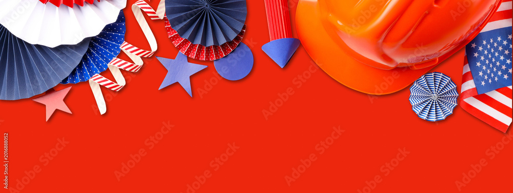 Fototapeta premium Colorful decorations for Labor Day celebrations with a hard hat