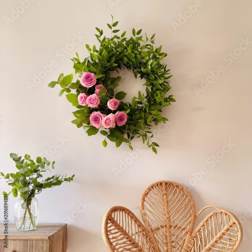 Roses and Leaves Create a Round Decoration Hung on a Wall in a Bright Room