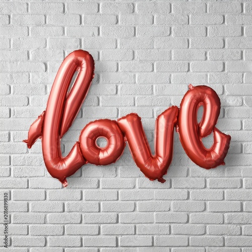 Red Balloon Letters Spelling Love on a White Brick Wall in a Bright Setting D...
