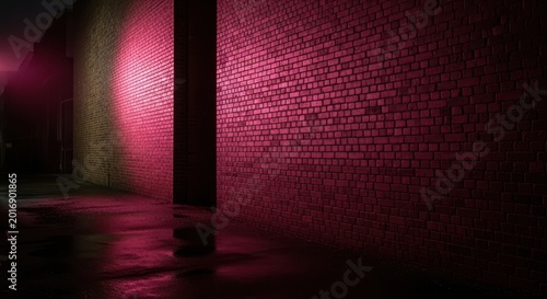 A dark alleyway with a red light shining on a brick wall at night