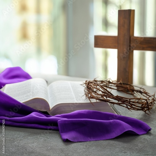 Bible Resting on a Table With a Crown of Thorns and a Cross in the Background...