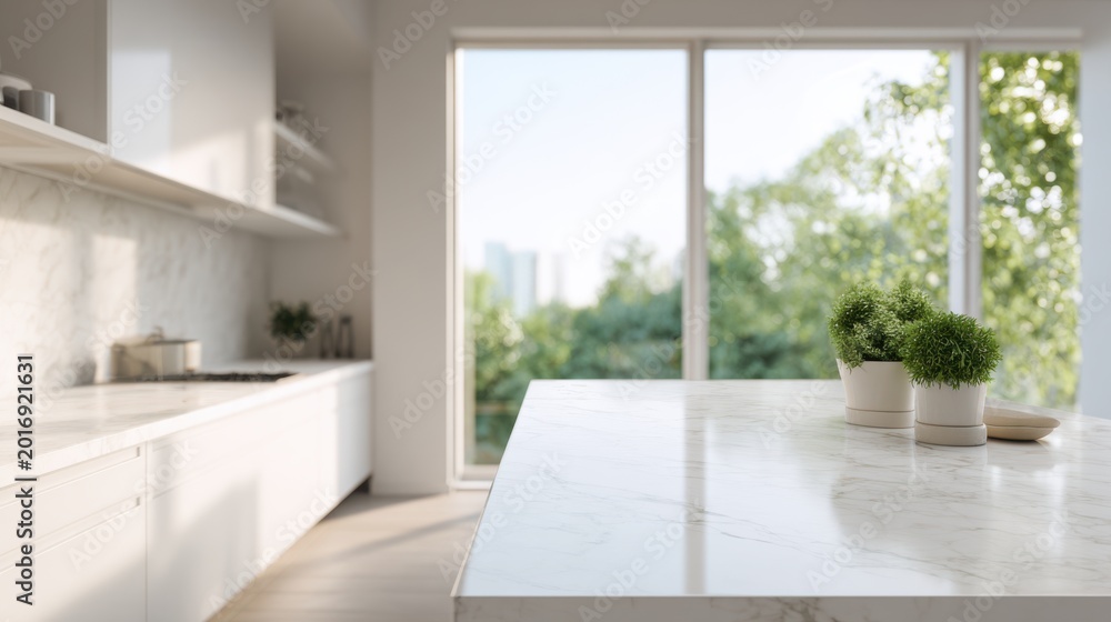 Fototapeta premium This space features a modern white kitchen with a clean marble countertop. Soft daylight fills the room, highlighting the minimal design and large windows with a view of nature