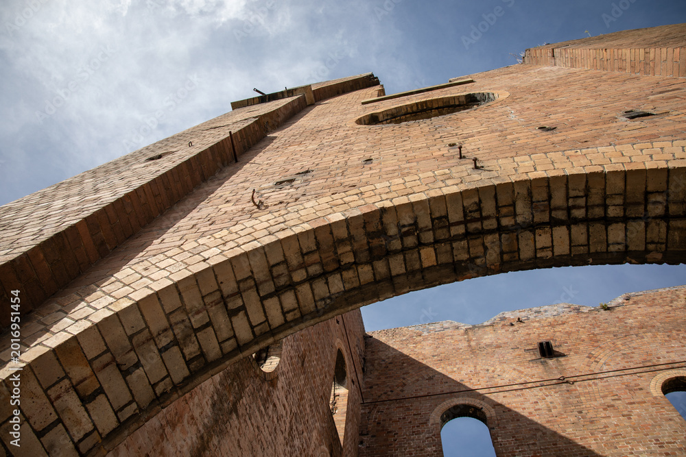 Obraz premium Historic Brick Architecture Against Blue Sky