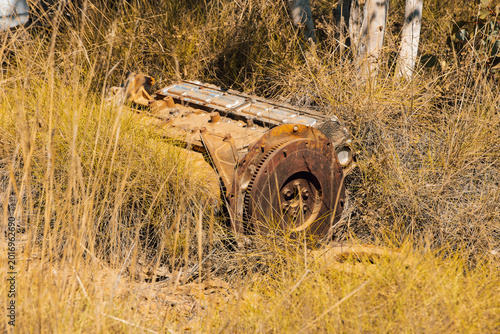 An old motor engine in the Australian bush, rusty and abandoned