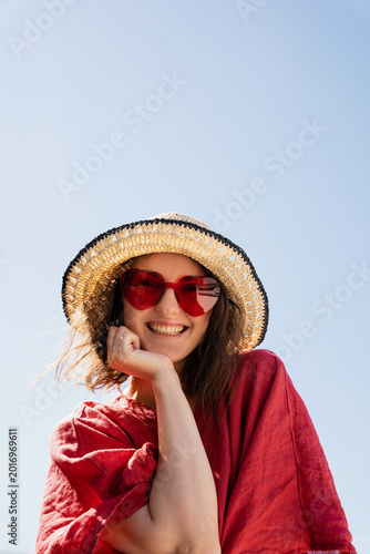 Portrait of Smiling Woman in Sunglasses and Hat