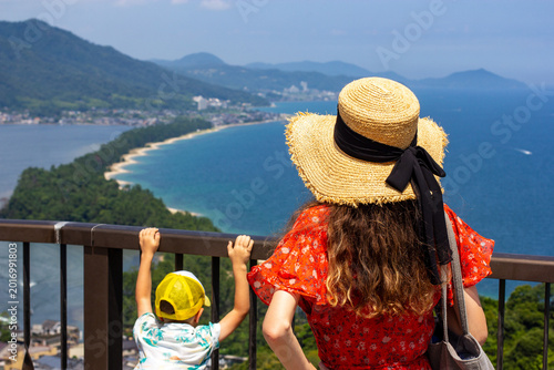 Foto Amanohashidate, Kyoto Prefecture, Japan, Summer, Lady tourist in hat with her small son