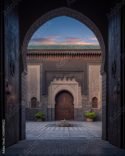 Intricate Courtyard Entrance with Arched Gateway and Fountain