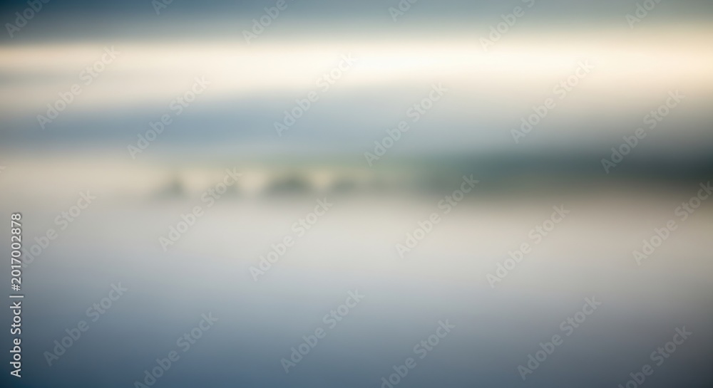 Fototapeta premium Abstract Blurred Landscape with Soft Colors and Atmospheric Effect.