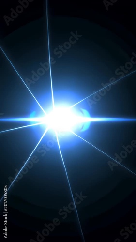 Dynamic blue light burst with radiant streaks expanding in dark space