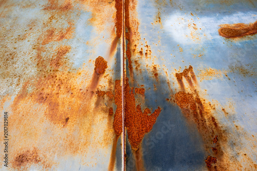 Fotografie Close-up abstract detail of heavily rusted and corroded metal surface with peeli