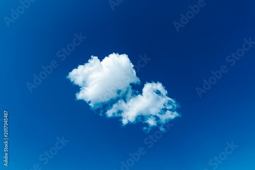 Tableau sur toile White cloud floating in a clear blue sky