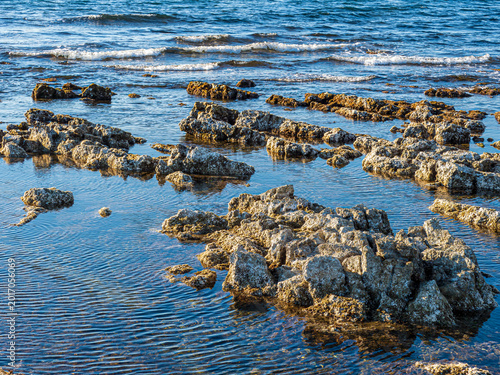 Coastal rocks emerging from sea water in Martigues, France
