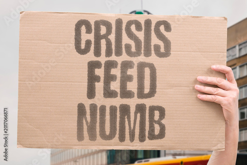 Fotografija "Crisis Feed Numb" Continuous crisis coverage in news feeds produces emotional numbness in viewers