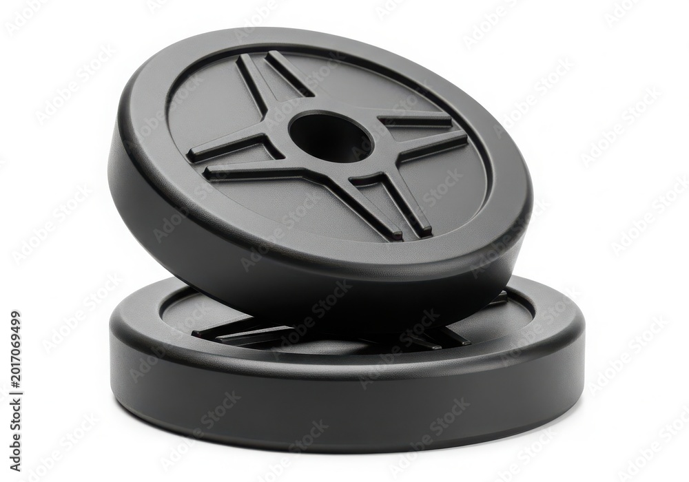 Obraz premium Two black weight plates for gym exercise equipment