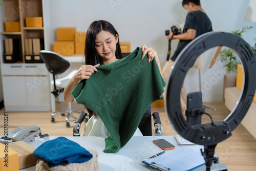 Asian vlogger woman influencer, selling show live sale online screen smartphone work at home.
