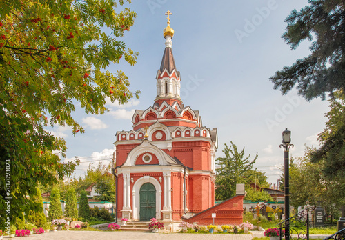 The red-brick Resurrection church-tomb with a high spire roof in the ancient estate of Count Peter Rumyantsev, Troitskoye-Kainarji. Zheleznodorozhny, Moscow oblast, Russia