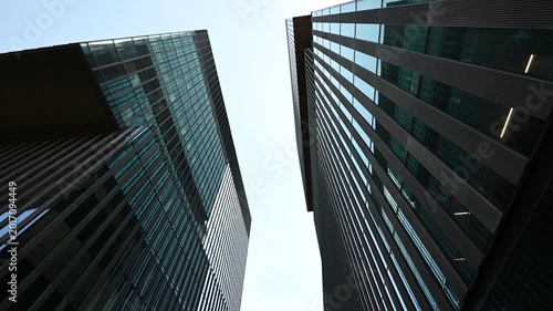 Modern Glass Skyscrapers Glistening Under a Clear Blue Sky, Showcasing Contemporary Business Architecture in Katowice, Poland