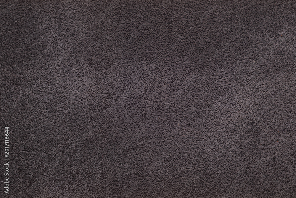 Fototapeta premium Close up of dark charcoal suede texture with natural surface structure for fashion background