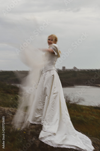 Bride with bouquet outdoors. Lifestyle and wedding concept.
