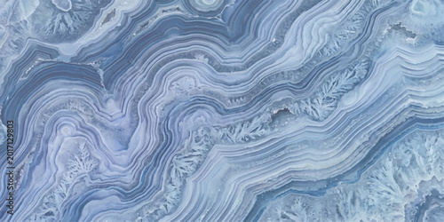 Photos A mesmerizing close-up captures the intricate patterns of a Blue Lace Agate, a gem of serene beauty