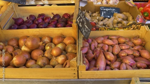 Fresh onions and shallots at French market stall