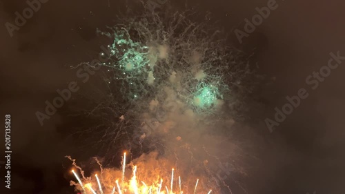Turquoise And Orange Fireworks In Dark Sky Video