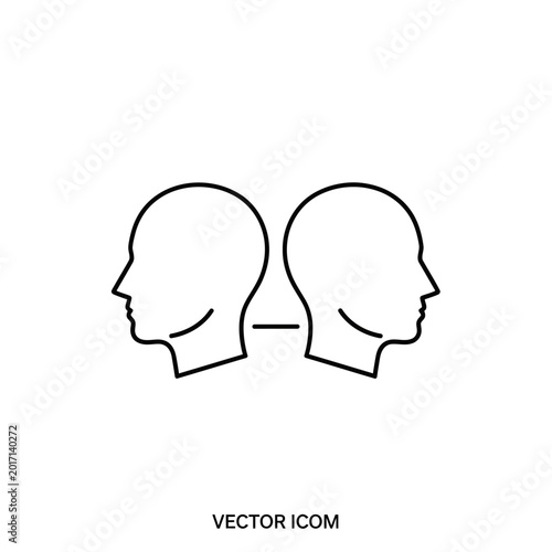 Two human head silhouettes facing each other.