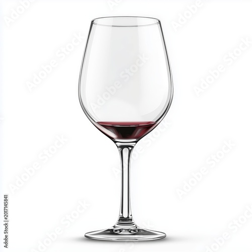 A wine glass with a small amount of red wine on a white background
