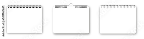 Photos Open spiral-bound notebook with white paper sheets