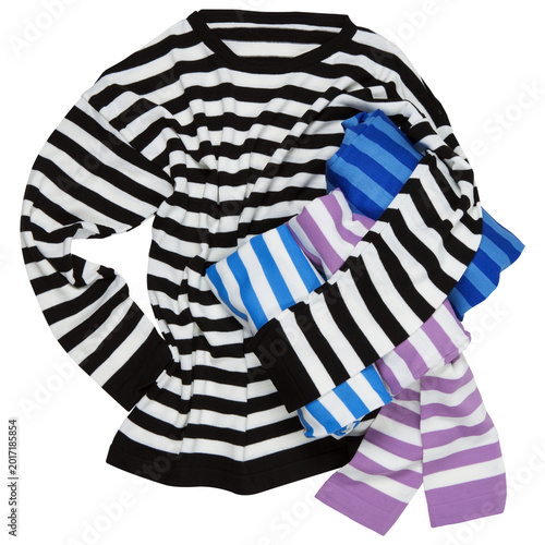 Invisible man in black and white striped sweater holding stack of folded clothes in one hand, striped sweater on white background, isolated.