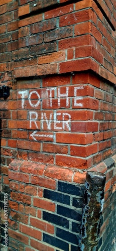 To the River Chalk Sign on Brick Wall in Cambridge City Centre