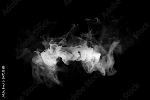 Obraz na plátne Abstract white smoke or wispy cloud isolated on black background