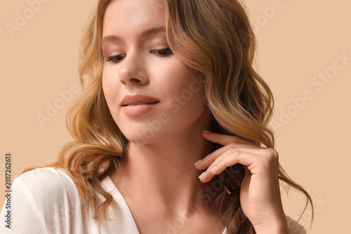 Blonde young woman with cur...