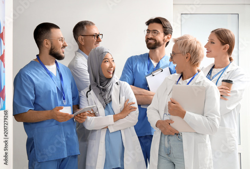 Doctors smiling in hall of ...
