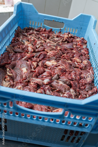 Картината върху платно Raw beef meat trimmings in plastic lined industrial crate