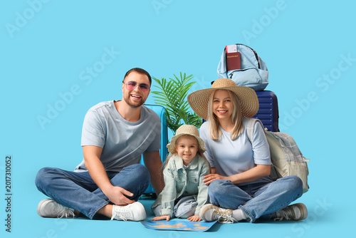Happy family with suitcase,...
