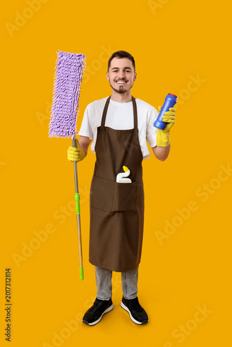 Male janitor with cleaning ...