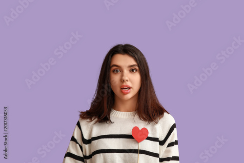 Shocked young girl with red...