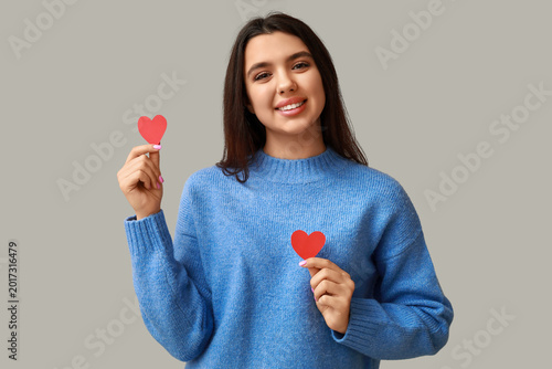 Happy young girl with red p...
